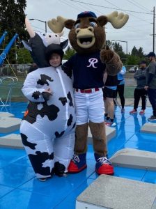 a person dressed as a cow, Brisket, and a moose at the Nisqually Valley Barbecue Rally  