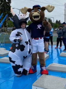a person dressed as a cow, Brisket, and a moose at the Nisqually Valley Barbecue Rally