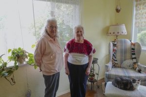 Patty and Inge standing in their home share