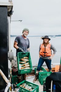 Jim McGreevey shows off some fresh geoducks ready to be farmed
