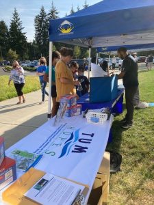 Tumwater HOPES event, people at a pop up tent