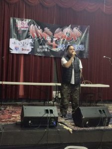 Jose Gutierrez Jr.  on stage at Hip Hop 4 Homeless event