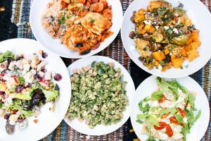 five plates of food from Farm to Fit on a table