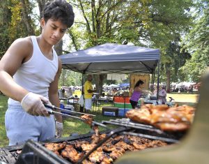 kid cooking on a grill at MOSAIC in Tacoma