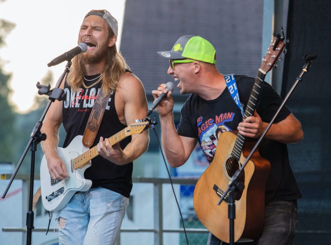 Isaac and Luke Olson playing a concert