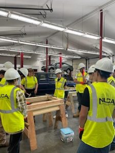 groups of students listening to an instructor at  ANEW Youth Career Exploration Program camp at Yelm High School