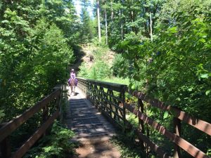 woman on a horse walking over the bridge at Margaret McKinney Campground