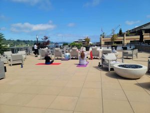 Harbor Heights, a 55+ community, residents doing yoga on the terrace