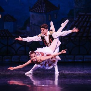 Gio Garibay and Natalie Allenton dancing on stage