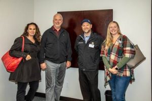 Amber Young, John Grantham, owner of Promo Northwest, Chris Lester, the Business Development Manager at Thurston County Title, and Kelli Yoder, the Business Development Assistant at Thurston County Title, at the Grand Opening of the Lacey Chamber’s new location. 