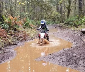 little kid on dirt bike at Middle Waddell Campground at Capitol Forest
