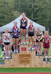 North Thurston's Alexis Meyer standing on a medal podium