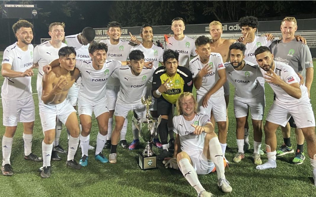 Oly town men's soccer team holding the super cup