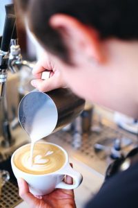Olympia Coffee Roasting prepares a latte