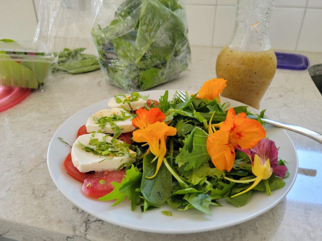 a fresh salad on a plate on a table