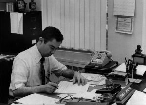 State Archivist Sid McAlpin, sitting at his desk in the 1970s 