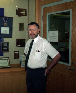 Sid McAlpin standing by a door on the day he retired, August 31, 1994. 