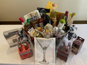 big gift basket with an assortment of items in it for the Drive out Cancer Golf Classic in Olympia