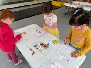 kids at a table working on art projects at South Sound Dance Fine Arts Club