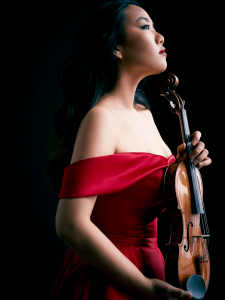 Stella Chen holding a violin