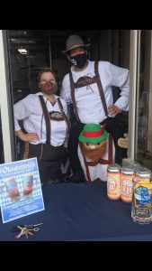 two men in lederhosen at Headless Mumby Brewing's Oktoberfest