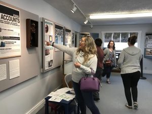 people inside the Lacey Museum, looking around