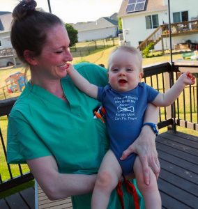 Dr. Tina Hajewski holding her son Tristan as a baby