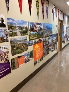 Pope John Paul II High School hallway full of college posters and information