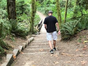 man walking down the trail at The Evergreen State College