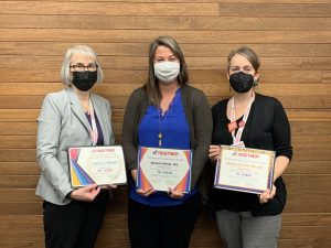 Morgan (left) with current Executive Director Meagan Darrow (center) and Deputy Director Meghan Sullivan recently celebrated a combined 50 years of service.