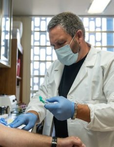 doctor in a mask working at Washington Department of Corrections in Mason County 