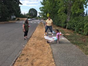 a child and two adults on the Sense of Place Walk