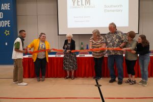 Kay Southworth-Martin of the Southworth family eagerly cut the ribbon to officially celebrate the opening of Southworth Elementary.