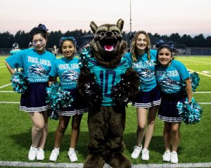 Northwest Christian Schools of Lacey cheer team with their mascot