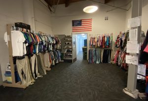 clothes hanging along the wall at Olympia Union Gospel Mission clothing bank