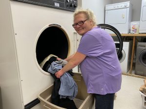 Karen Schaeffer doing no-cost laundry for the Olympia Union Gospel Mission