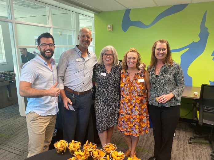 SCJ team members from multiple offices, including CEO Jean Carr center, help the Gig Harbor team celebrate the opening of their new office.