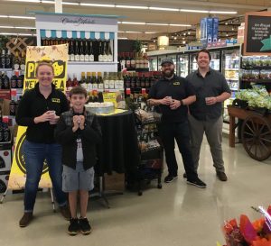 family trying samples at Thriftway's Fall Festival in Olympia