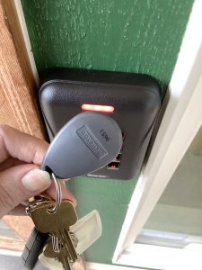 key fob being held against an entry pad