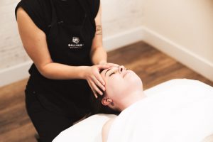 person getting their head massaged at Ballaura Wellness Spa in Olympia