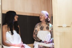 two women sitting in the infrared sauna at Ballaura Wellness Spa in Olympia