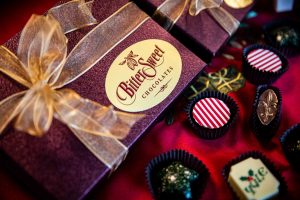 beautifully wrapped chocolate box with a bow