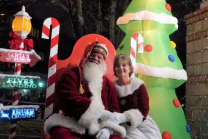Santa and Mrs. Claus sitting on a candy cane throne in the City of Lacey