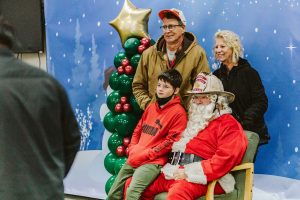 family getting their photo taken with Santa in Tumwater