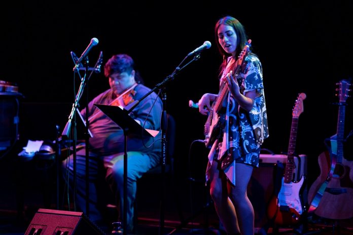 Indigenous Performance Productions artists playing music on stage