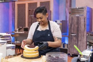 Lauren Rogers at her station, busy working on a cake  for the Halloween Baking Championship