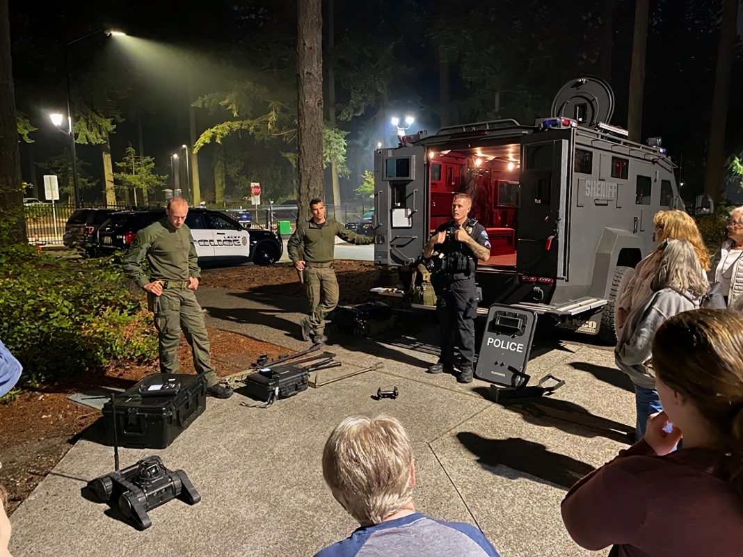 Lacey SWAT members speaking to civilians during community academy