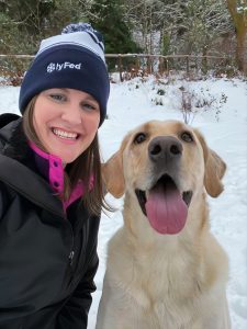 Alison Densley with a lab in the snow