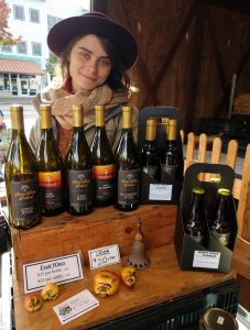 Burnt Ridge Nursery & Orchards's Annie J at her wine booth at Olympia Farmers Market