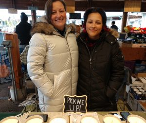 Mother-daughter business team Sarah and Audrey Silva at their candle booth at Olympia Farmers Market